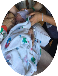 A mother breastfeeding her new baby.